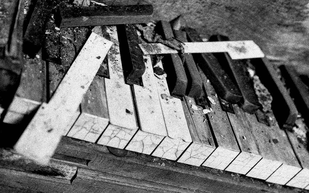piano abandoned broken weathered lost  black and white film photography Johnny Martyr