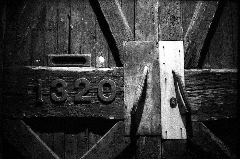 1320 door rustic wood metal old vintage weathered black and white film photography