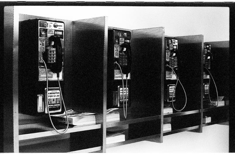 Bank of Payphones at Dulles International Airport Pentax ME 40mm SMC Kodak Tri-X black and white film photography
